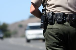 a police officer watching traffic